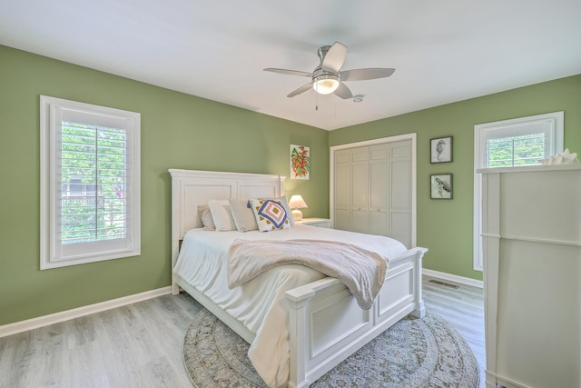 13 32nd Ave, Isle Of Palms, SC 29451 - bedroom with light wood-style flooring, baseboards, and a closet