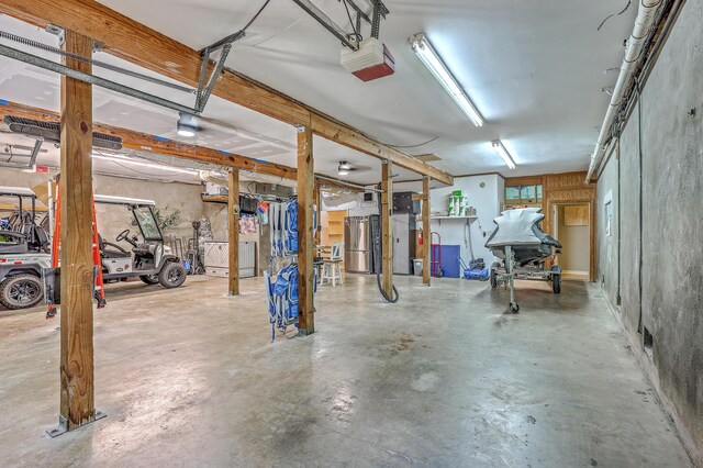 13 32nd Ave, Isle Of Palms, SC 29451 - garage with a garage door opener and freestanding refrigerator