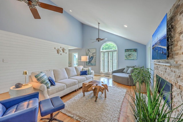 13 32nd Ave, Isle Of Palms, SC 29451 - living room featuring ceiling fan, light wood-style floors, high vaulted ceiling, a fireplace, and recessed lighting