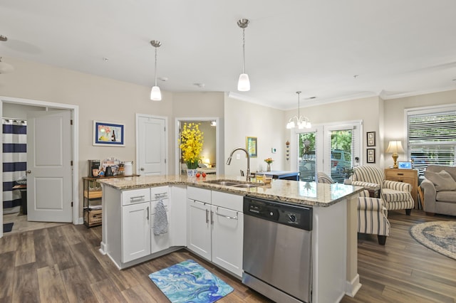 kitchen featuring white cabinets, light stone countertops, a sink, dishwasher, and a chandelier