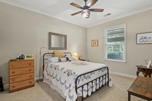 bedroom with crown molding, ceiling fan, light carpet, baseboards, and visible vents