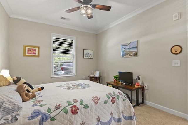carpeted bedroom featuring baseboards, ornamental molding, ceiling fan, and visible vents