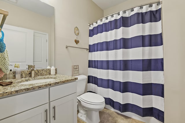 bathroom featuring toilet, tile patterned floors, a shower with curtain, and vanity