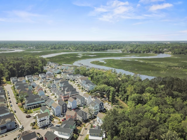 bird's eye view with a residential view, view of golf course, a water view, and a wooded view