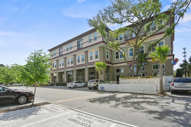 view of property with uncovered parking