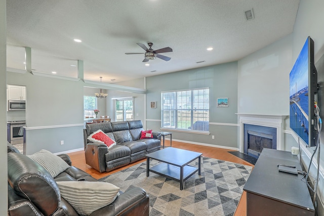 6179 Fieldstone Cir, Charleston, SC 29414 - living room featuring ceiling fan, light wood-style floors, a fireplace with flush hearth, recessed lighting, and baseboards