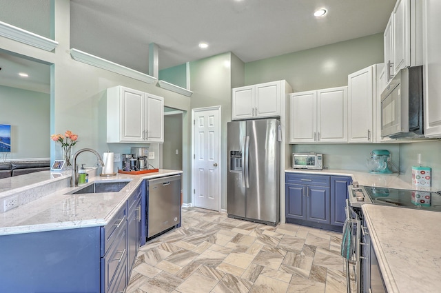 6179 Fieldstone Cir, Charleston, SC 29414 - kitchen with appliances with stainless steel finishes, a sink, white cabinets, blue cabinets, and recessed lighting