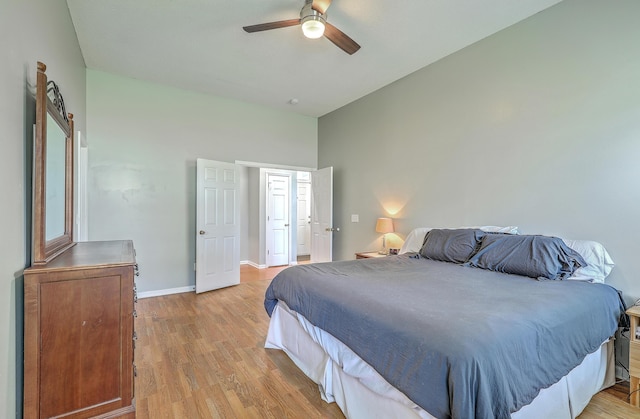 6179 Fieldstone Cir, Charleston, SC 29414 - bedroom featuring light wood-style flooring, baseboards, high vaulted ceiling, and ceiling fan