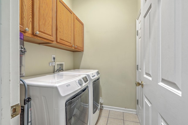 6179 Fieldstone Cir, Charleston, SC 29414 - laundry area with independent washer and dryer, cabinet space, light tile patterned floors, and baseboards