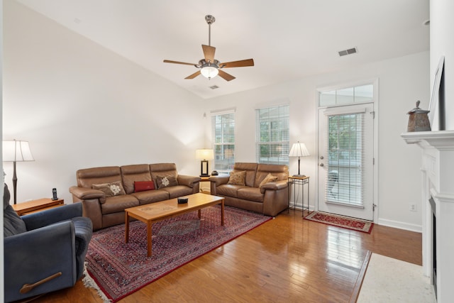 living room with hardwood / wood-style floors, ceiling fan, and a wealth of natural light