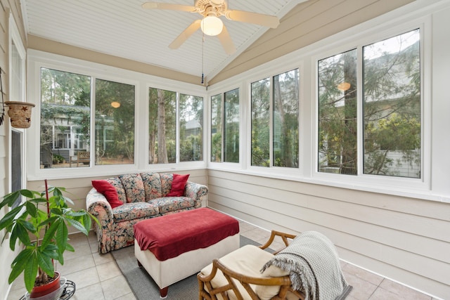 sunroom with ceiling fan and vaulted ceiling