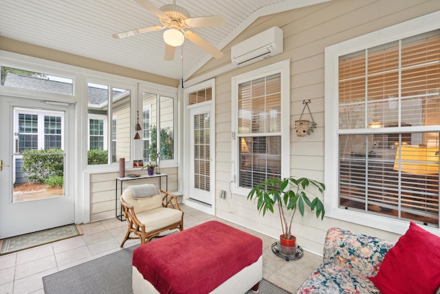 sunroom / solarium with ceiling fan, lofted ceiling, and a wall unit AC