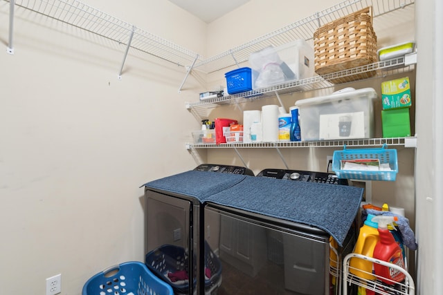 washroom featuring washing machine and dryer