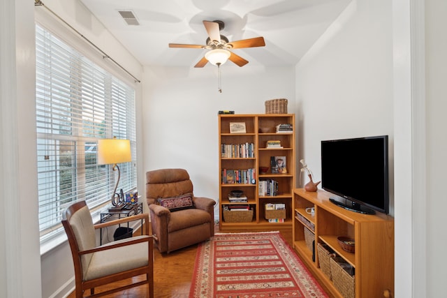 sitting room featuring hardwood / wood-style flooring and ceiling fan