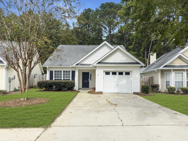 view of front of house with a garage and a front lawn