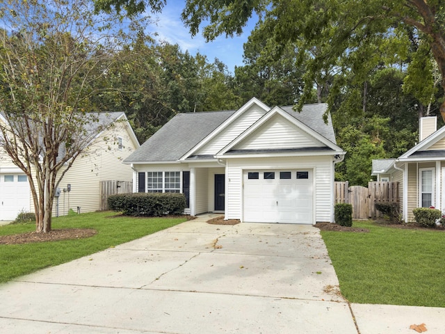 view of front of home featuring a garage and a front yard