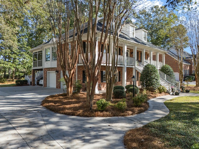 view of front of house with a garage and a porch