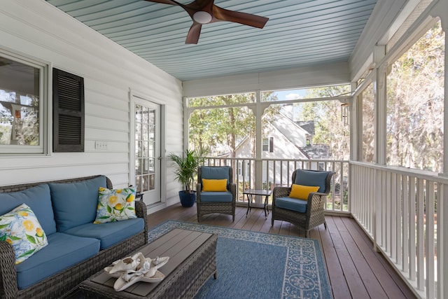 sunroom featuring wooden ceiling and ceiling fan