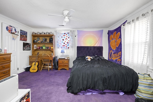 bedroom featuring multiple windows, a textured ceiling, carpet flooring, and ceiling fan