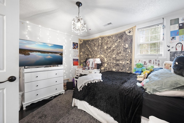 bedroom featuring a chandelier, a textured ceiling, and ornamental molding