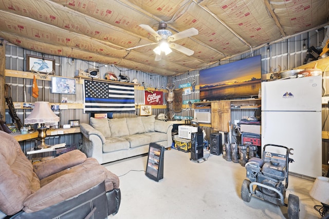 living room with ceiling fan and concrete floors