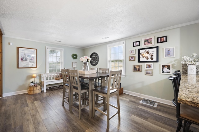 dining room featuring a wealth of natural light, dark hardwood / wood-style flooring, and ornamental molding