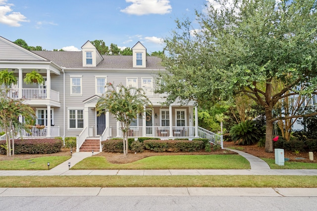 view of front of house featuring a balcony and a porch