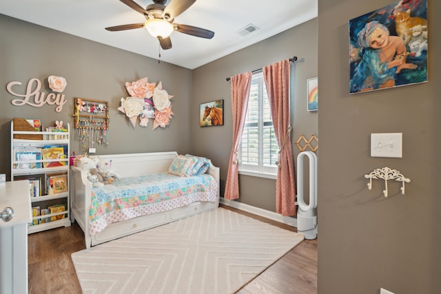 bedroom featuring hardwood / wood-style floors and ceiling fan