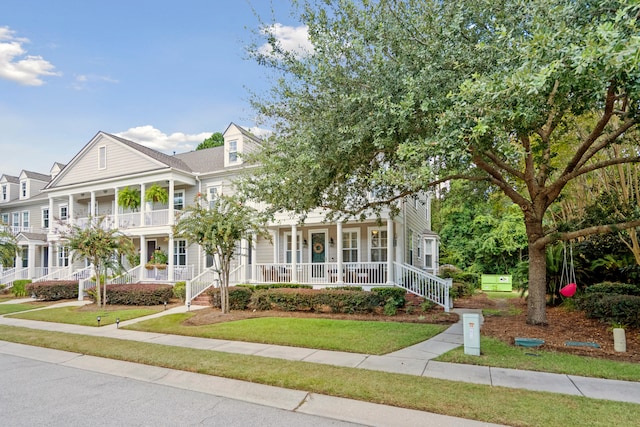 view of front facade with a porch and a front yard