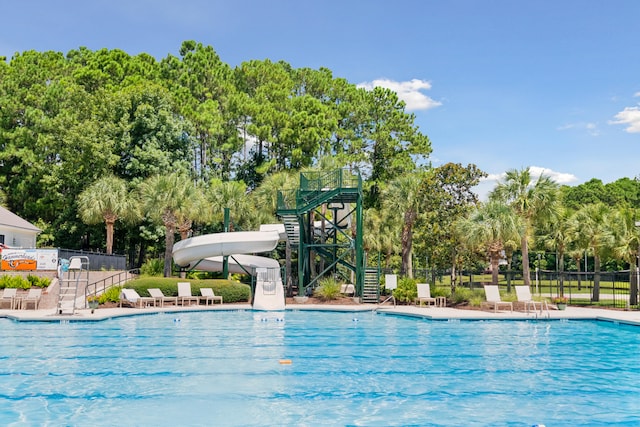 view of pool with a water slide