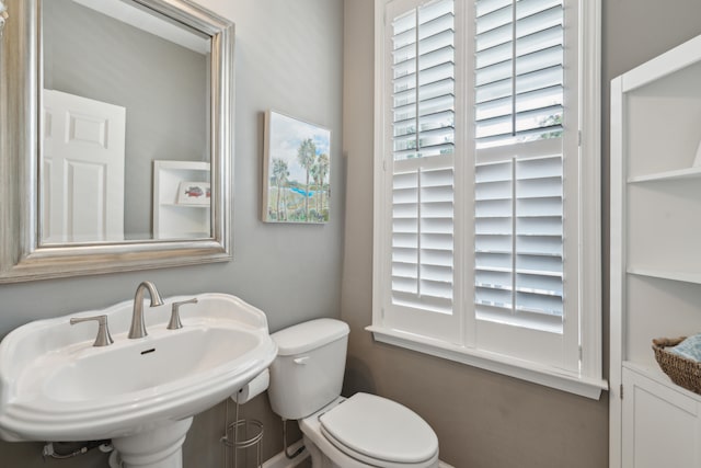 bathroom with toilet and sink