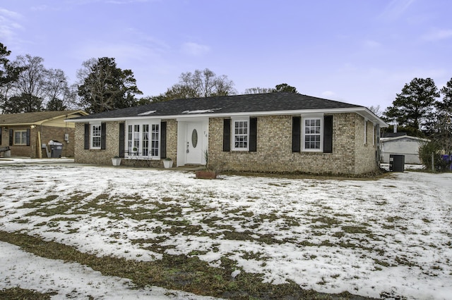 single story home featuring central air condition unit