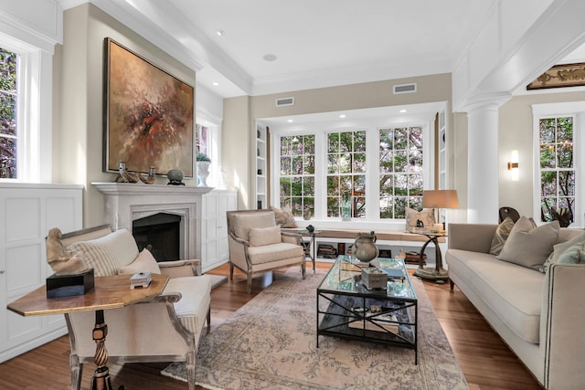 living room featuring hardwood / wood-style flooring and a healthy amount of sunlight