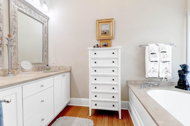 bathroom with vanity and hardwood / wood-style flooring