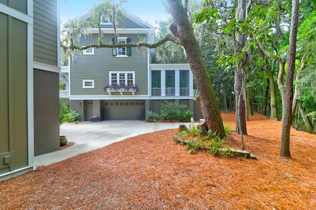 rear view of property with a garage