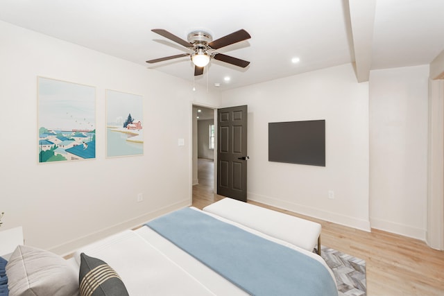 bedroom with light hardwood / wood-style floors and ceiling fan