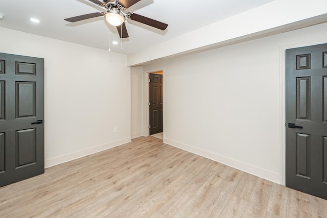 empty room featuring light hardwood / wood-style floors and ceiling fan