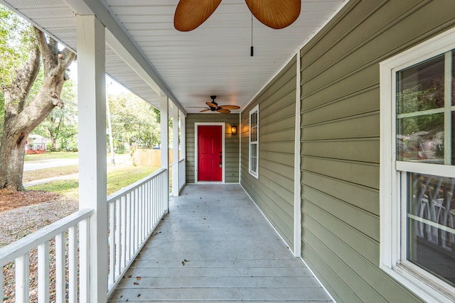 view of patio with ceiling fan and a porch