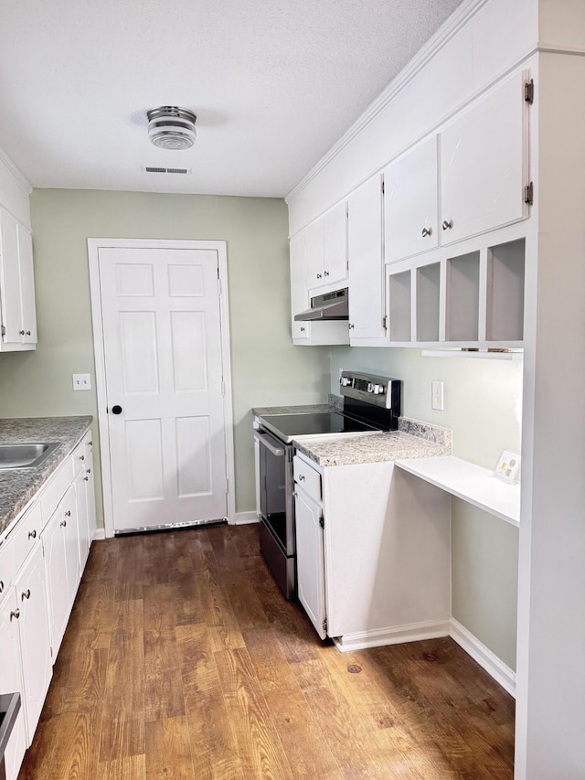 kitchen featuring stainless steel range with electric cooktop, white cabinetry, hardwood / wood-style flooring, and sink