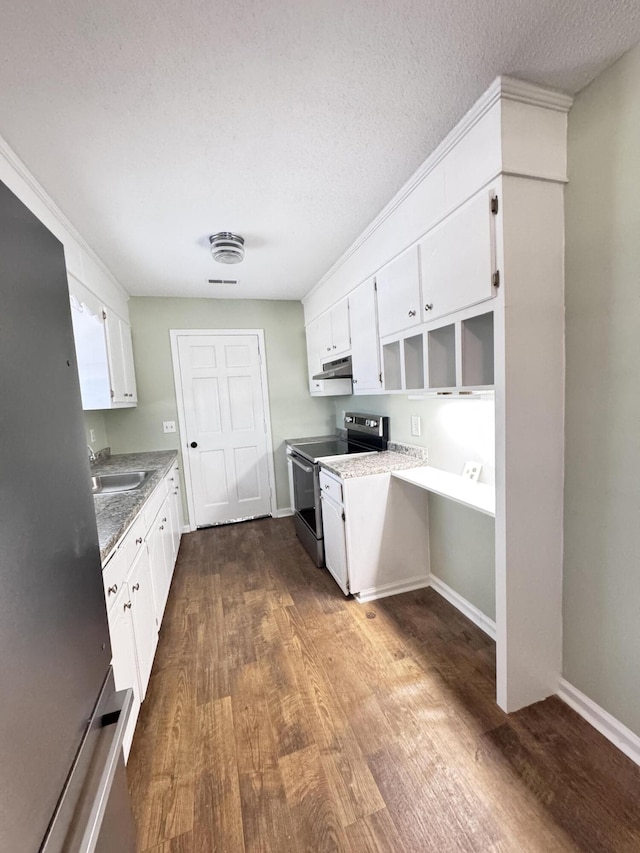 kitchen featuring stainless steel range with electric stovetop, white cabinetry, dark hardwood / wood-style floors, a textured ceiling, and sink