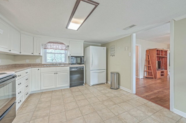 kitchen with visible vents, white cabinets, a textured ceiling, black appliances, and a sink