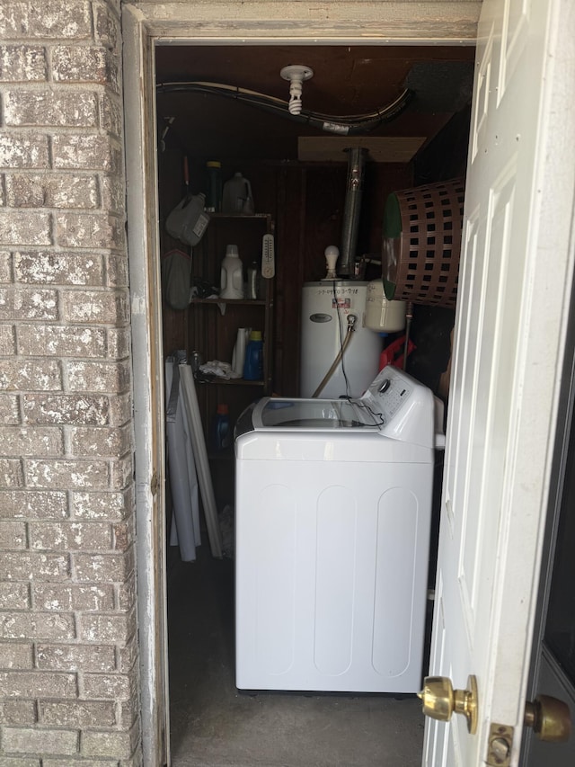 laundry room featuring washer / dryer and water heater