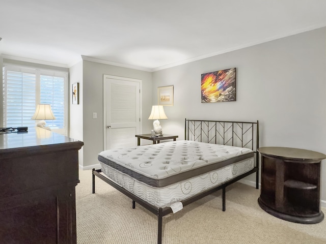 bedroom with crown molding and light carpet