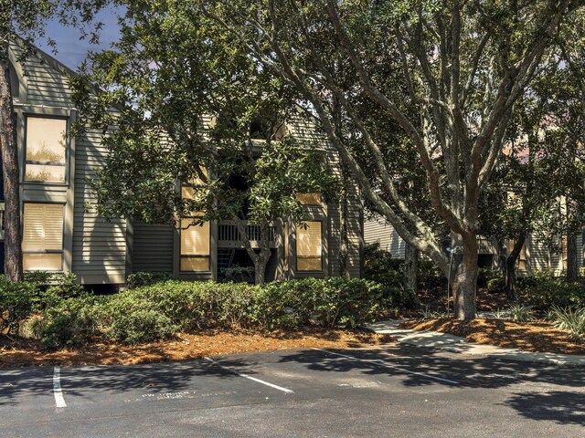 exterior space featuring ceiling fan and beam ceiling