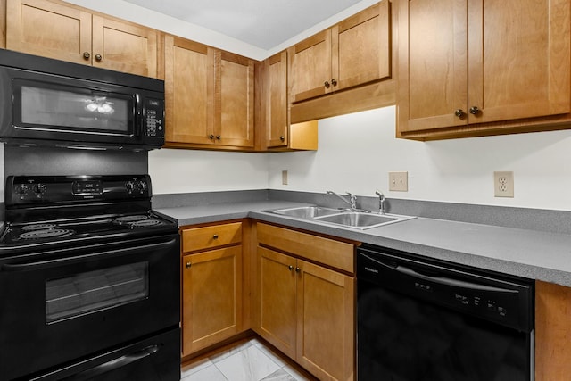 7950 Parklane Ct Unit C, North Charleston, SC 29418 - kitchen featuring black appliances, light marble finish flooring, and brown cabinets