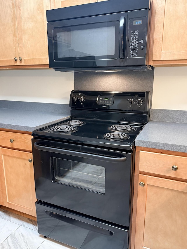7950 Parklane Ct Unit C, North Charleston, SC 29418 - kitchen with black appliances, light brown cabinetry, and light marble finish flooring