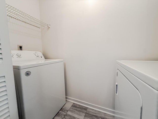 7950 Parklane Ct Unit C, North Charleston, SC 29418 - laundry area with washer and clothes dryer and baseboards