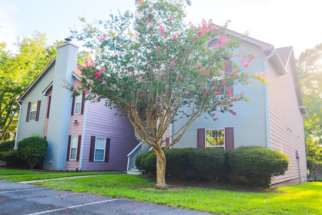 7950 Parklane Ct Unit C, North Charleston, SC 29418 - view of front of home featuring a chimney and a front lawn
