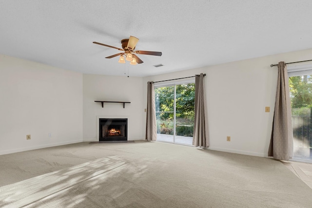 7950 Parklane Ct Unit C, North Charleston, SC 29418 - unfurnished living room featuring light carpet, a warm lit fireplace, and a ceiling fan