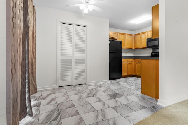 7950 Parklane Ct Unit C, North Charleston, SC 29418 - kitchen with black appliances, ceiling fan, dark countertops, and light marble finish flooring